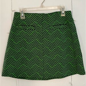 Green and black mini skirt with front pockets. Size: Small, Brand: Forever 21
